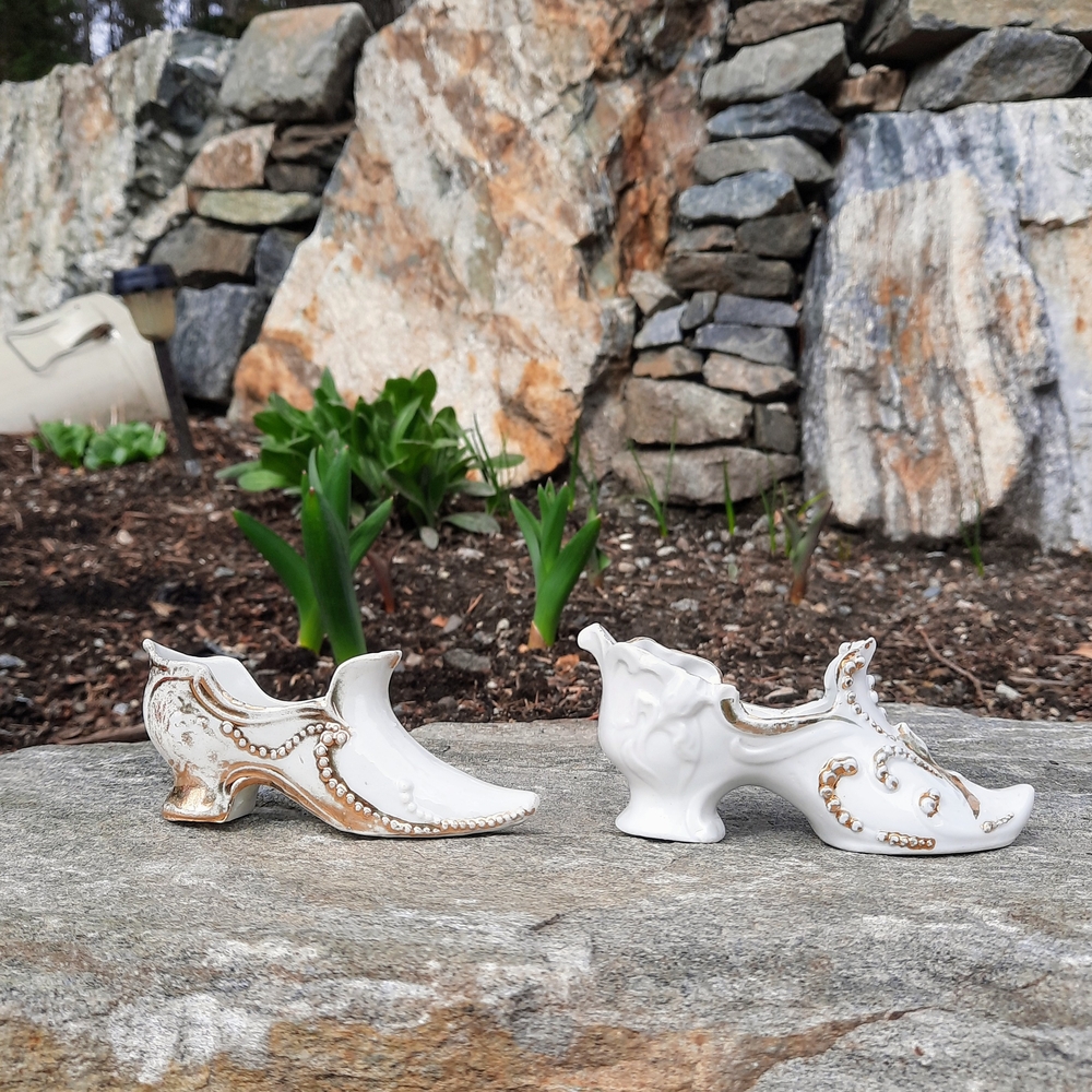 Set of two antique porcelain miniature figurine shoes with real gold details